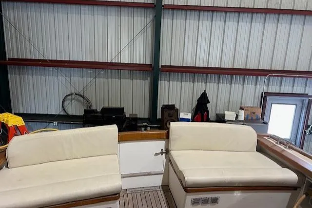 Daisy IV Yacht Photos Pics 2001 Little Harbor WhisperJet 44 interior with white seating in a storage facility.