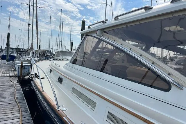 Daisy IV Yacht Photos Pics 2001 Little Harbor WhisperJet 44 docked at marina, showcasing sleek design and elegant lines.