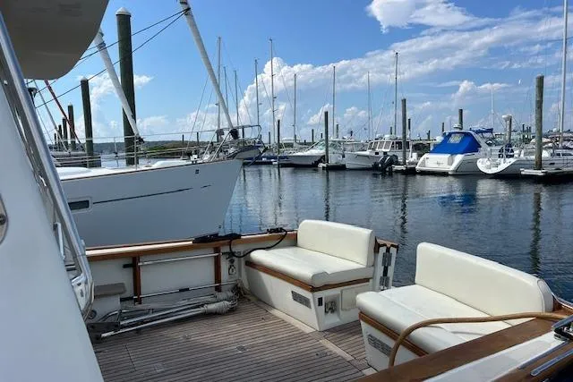 Daisy IV Yacht Photos Pics 2001 Little Harbor WhisperJet 44 yacht docked at marina with clear skies.