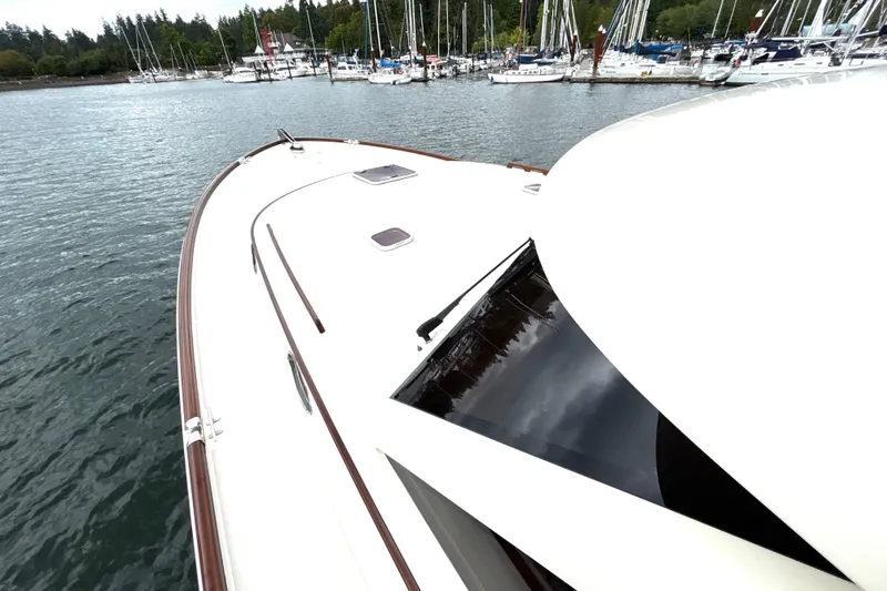 Flight Yacht Photos Pics San Juan 48 yacht, 2009 model, docked in a marina with sailboats.