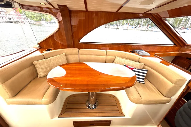 Flight Yacht Photos Pics Luxurious 2009 San Juan 48 yacht interior with elegant wood finish and plush seating.