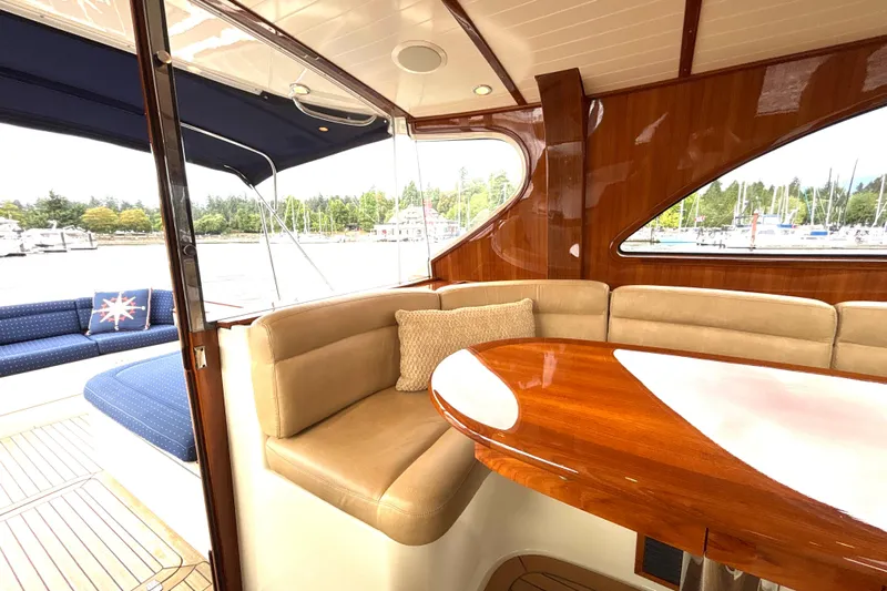 Flight Yacht Photos Pics Luxurious interior of 2009 San Juan 48 yacht with polished wood and comfortable seating.