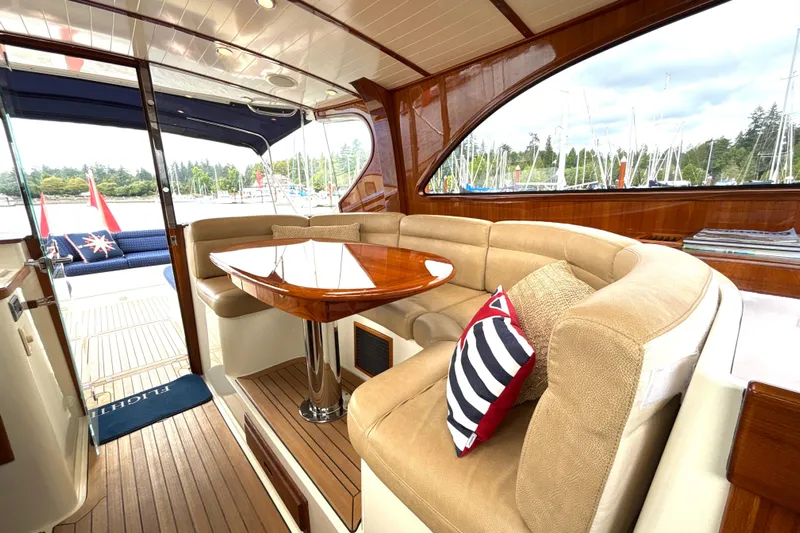 Flight Yacht Photos Pics Luxurious interior of 2009 San Juan 48 yacht with elegant seating and wooden finishes.