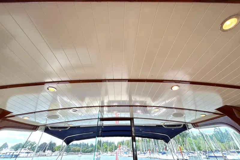 Flight Yacht Photos Pics Interior ceiling of 2009 San Juan 48 yacht with recessed lighting and marina view.