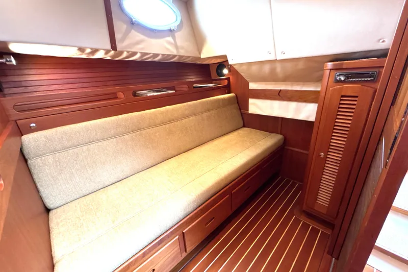 Flight Yacht Photos Pics Luxurious 2009 San Juan 48 yacht interior with wooden finishes and comfortable seating.