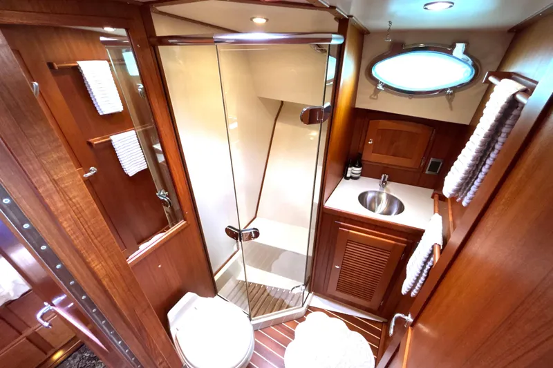 Flight Yacht Photos Pics Luxurious 2009 San Juan 48 yacht bathroom with wood accents and modern fixtures.