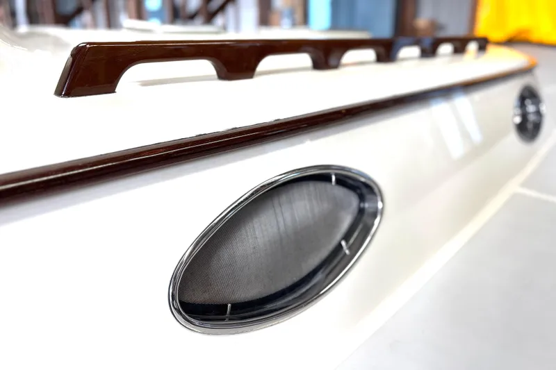 Flight Yacht Photos Pics Close-up of 2009 San Juan 48 yacht's sleek exterior design and porthole detail.