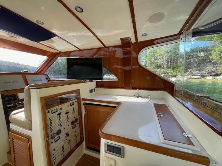 Flight Yacht Photos Pics Interior of 2009 San Juan 48 yacht with control panel and scenic window view.