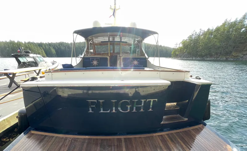 Flight Yacht Photos Pics 2009 San Juan 48 yacht named "FLIGHT" docked in a scenic waterway.