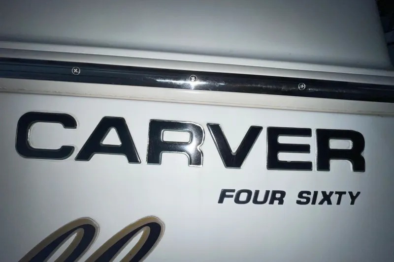  Yacht Photos Pics Carver 460 Voyager 2004 boat nameplate with bold lettering.