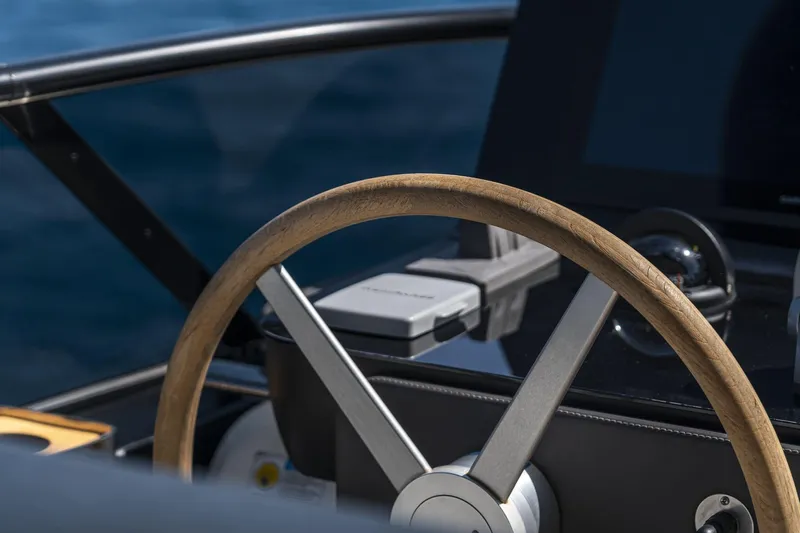 Orca I Yacht Photos Pics Steering wheel of 2022 Cranchi Settantotto 78 yacht, showcasing luxury design and craftsmanship.
