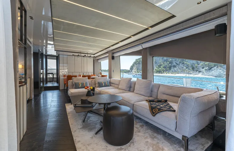 Orca I Yacht Photos Pics Luxurious interior of 2022 Cranchi Settantotto 78 yacht with ocean view and modern furnishings.