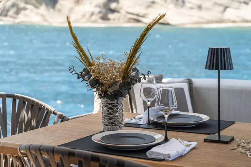 Orca I Yacht Photos Pics Elegant dining setup on Cranchi Settantotto 78 yacht, 2022, with ocean view.