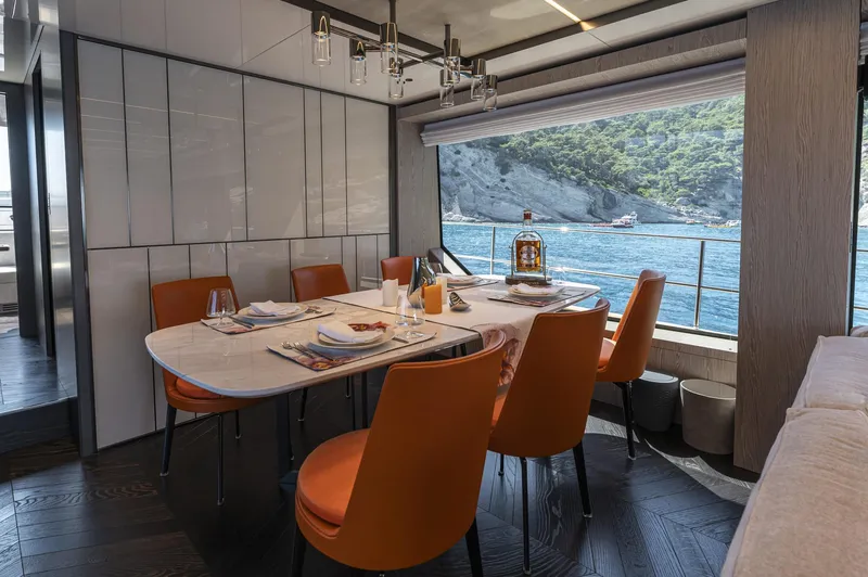 Orca I Yacht Photos Pics Luxurious dining area on 2022 Cranchi Settantotto 78 yacht with ocean view.