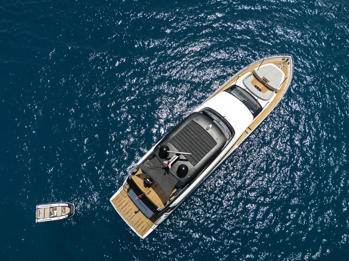 Orca I Yacht Photos Pics Aerial view of 2022 Cranchi Settantotto 78 yacht on blue ocean water.