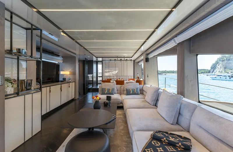 Orca I Yacht Photos Pics Luxurious interior of 2022 Cranchi Settantotto 78 yacht with modern furnishings and scenic ocean view.