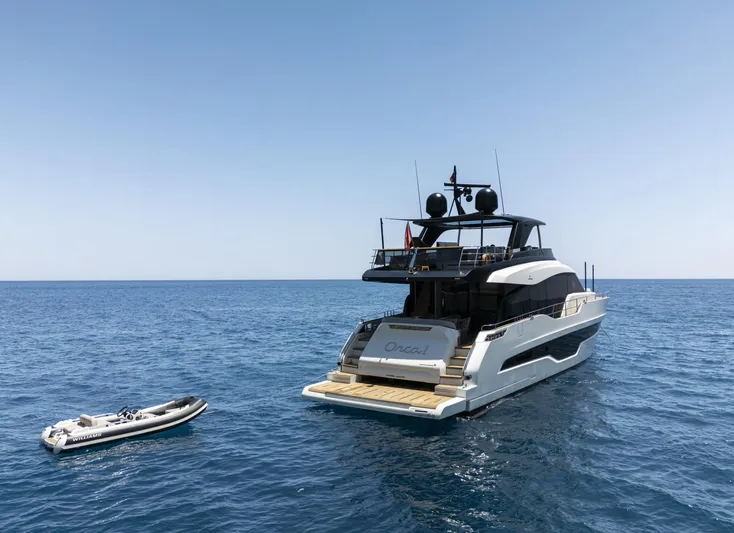 Orca I Yacht Photos Pics 2022 Cranchi Settantotto 78 yacht on open sea with inflatable boat nearby.