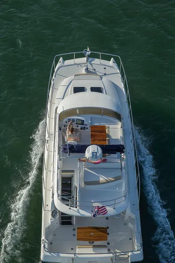  Yacht Photos Pics Aspen C120 Flybridge 2026 cruising on open water, aerial view.