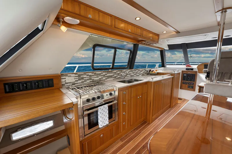  Yacht Photos Pics Luxurious 2026 Aspen C120 Flybridge yacht interior with modern kitchen and ocean view.