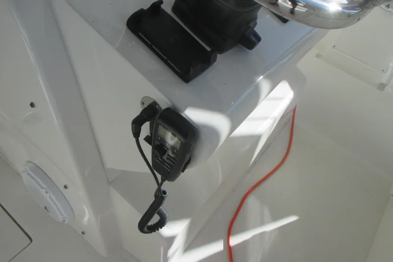  Yacht Photos Pics 2012 Jupiter 30 FS boat interior with mounted radio and coiled cable.