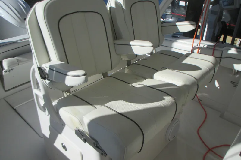  Yacht Photos Pics 2012 Jupiter 30 FS boat interior with white cushioned seating and armrests.
