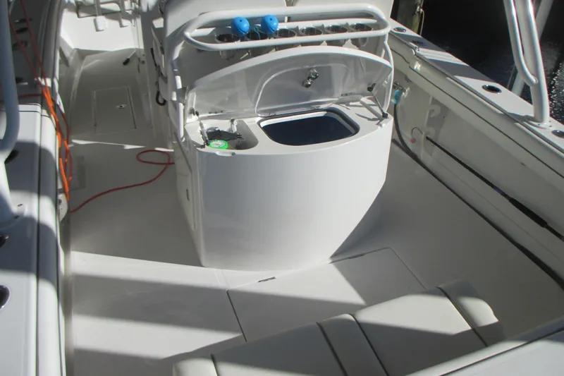  Yacht Photos Pics 2012 Jupiter 30 FS boat interior with open storage compartment and seating area.