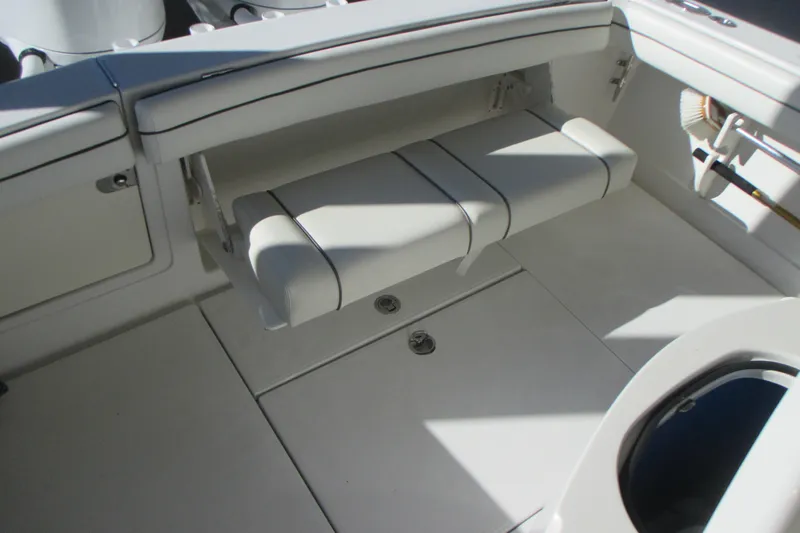  Yacht Photos Pics 2012 Jupiter 30 FS boat interior with white cushioned seating and storage compartments.
