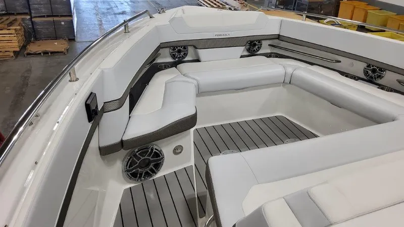  Yacht Photos Pics 2023 Formula 380 Super Sport Crossover OB boat interior with white seating and speakers.