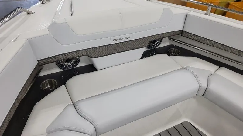  Yacht Photos Pics 2023 Formula 380 Super Sport Crossover OB interior seating area with cup holders and speakers.