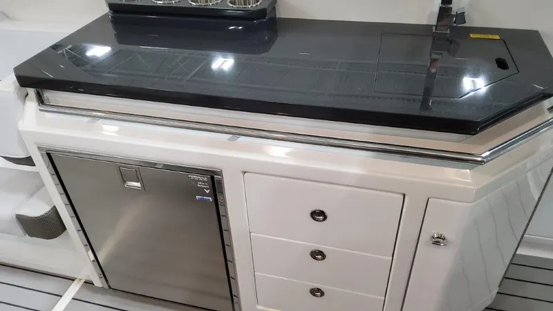  Yacht Photos Pics 2023 Formula 380 Super Sport Crossover OB galley with stainless steel fridge and storage drawers.