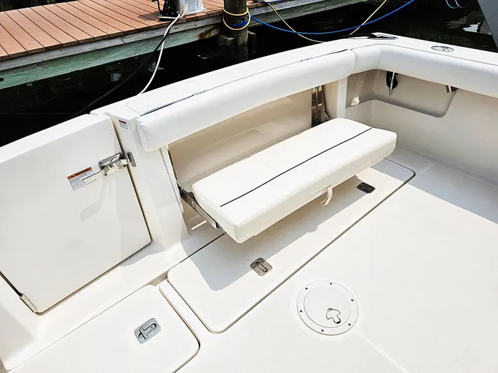 Fidgit Yacht Photos Pics 2006 Tiara Yachts 2900 Open Classic boat interior with foldable seating and storage.