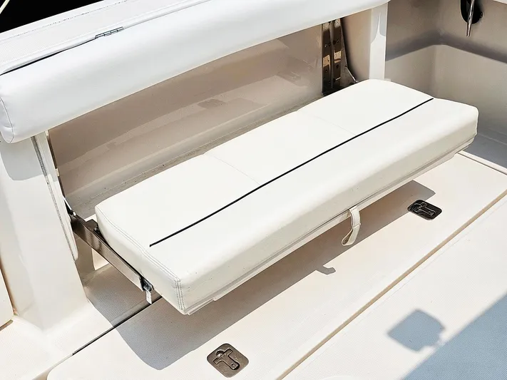 Fidgit Yacht Photos Pics 2006 Tiara Yachts 2900 Open Classic, white fold-out bench seat detail.