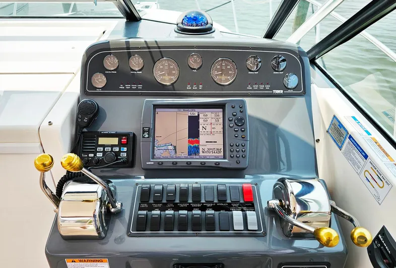 Fidgit Yacht Photos Pics Helm of 2006 Tiara Yachts 2900 Open Classic with navigation and control instruments.