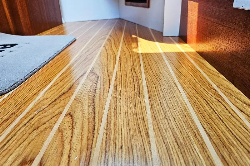 Fidgit Yacht Photos Pics Wooden flooring inside 2006 Tiara Yachts 2900 Open Classic, showcasing elegant design.