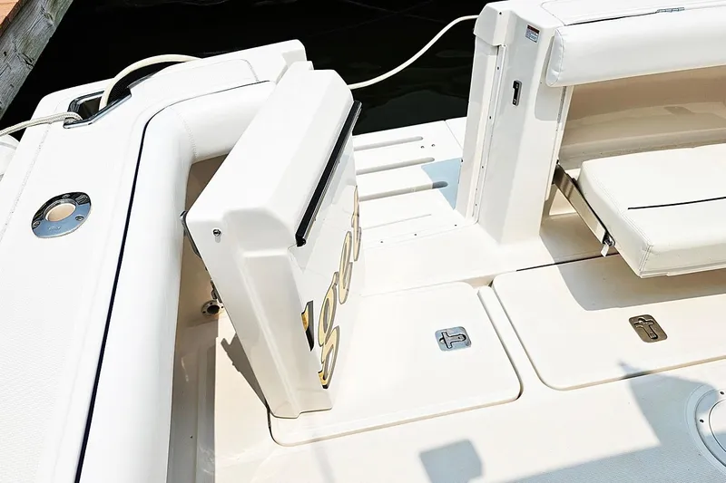 Fidgit Yacht Photos Pics 2006 Tiara Yachts 2900 Open Classic boat deck with seating and storage compartments.