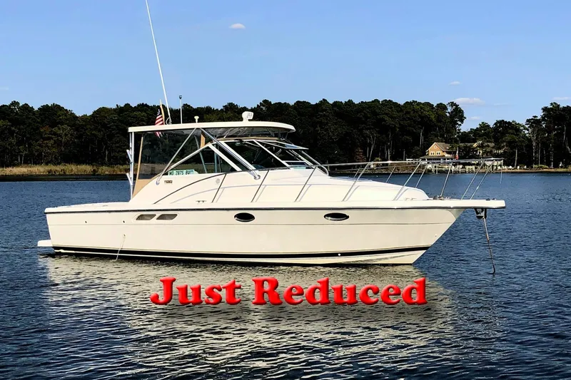 Fidgit Yacht Photos Pics 2006 Tiara Yachts 2900 Open boat on water, "Just Reduced" text overlay.