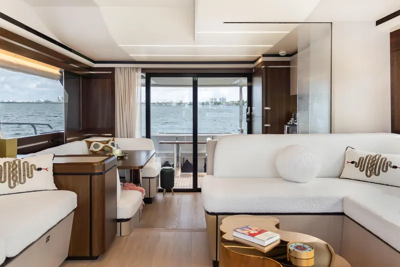 Triangle Yacht Photos Pics Luxurious interior of 2019 Absolute 58 FLY yacht with elegant seating and ocean view.