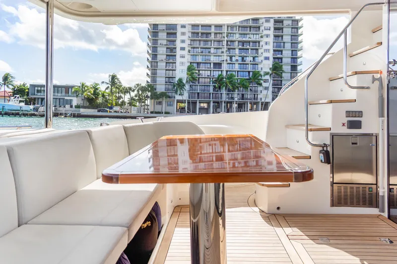 Triangle Yacht Photos Pics Luxurious 2019 Absolute 58 FLY yacht interior with elegant seating and wooden table.