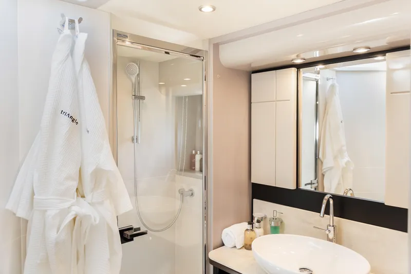 Triangle Yacht Photos Pics Luxurious bathroom on 2019 Absolute 58 FLY yacht with modern fixtures and elegant design.