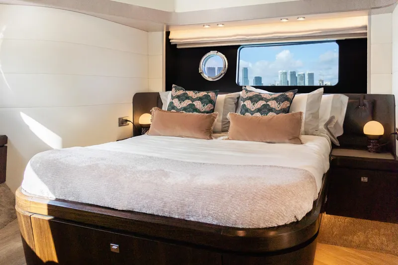 Triangle Yacht Photos Pics Luxurious bedroom interior of 2019 Absolute 58 FLY yacht with cityscape view.
