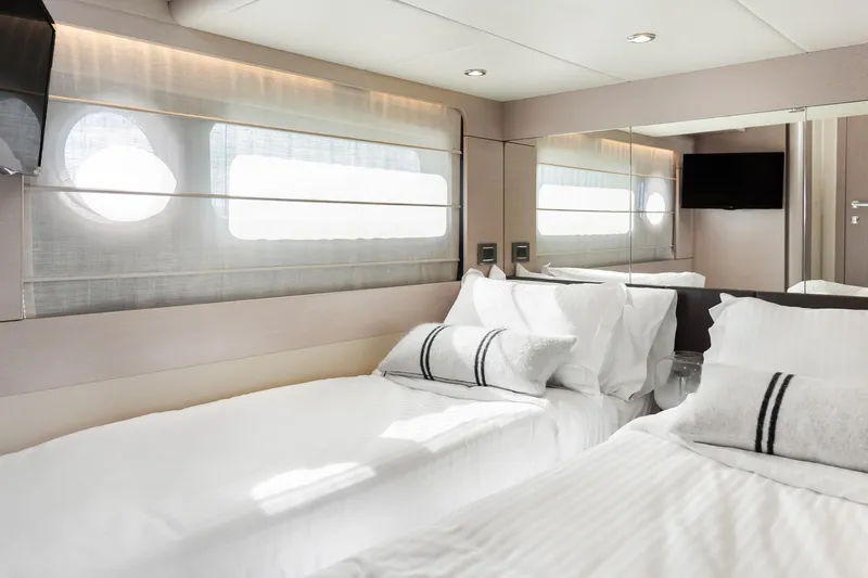 Triangle Yacht Photos Pics Luxurious cabin interior of 2019 Absolute 58 FLY yacht with twin beds and modern decor.