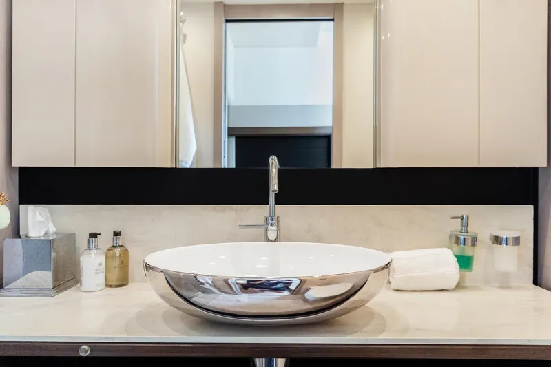 Triangle Yacht Photos Pics Luxurious bathroom sink on Absolute 58 FLY yacht, 2019 model, with elegant fixtures and toiletries.