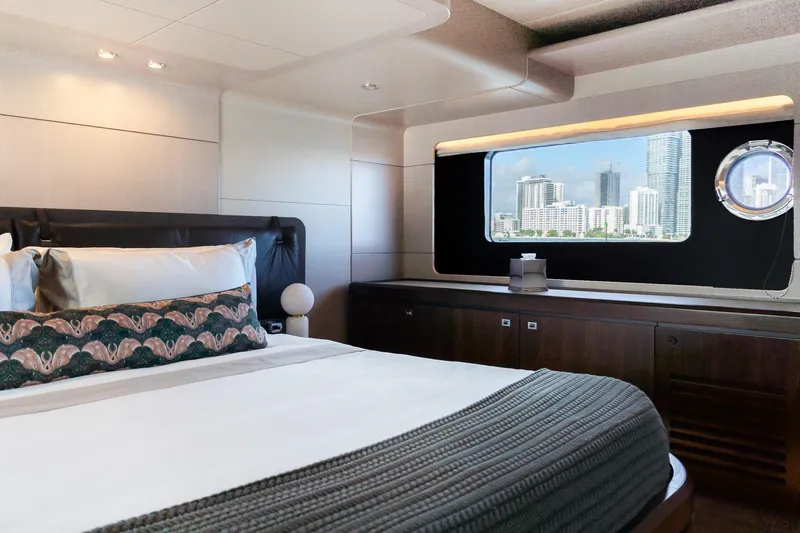Triangle Yacht Photos Pics Luxurious bedroom interior of 2019 Absolute 58 FLY yacht with cityscape view.