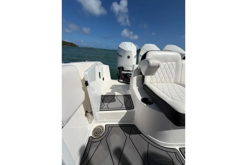  Yacht Photos Pics 2023 Fountain 34 Center Console boat interior with seating and outboard motors.