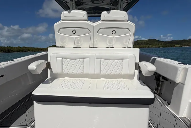  Yacht Photos Pics 2023 Fountain 34 Center Console boat interior with white cushioned seating.