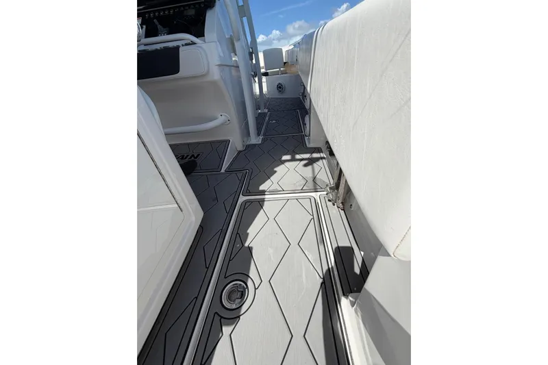  Yacht Photos Pics 2023 Fountain 34 Center Console boat interior with sleek flooring and seating.