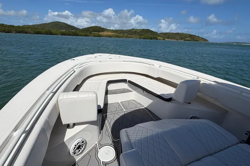  Yacht Photos Pics 2023 Fountain 34 Center Console boat interior with luxurious seating on open water.