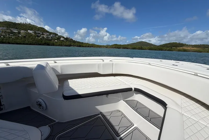  Yacht Photos Pics 2023 Fountain 34 Center Console boat interior with scenic water and hillside view.