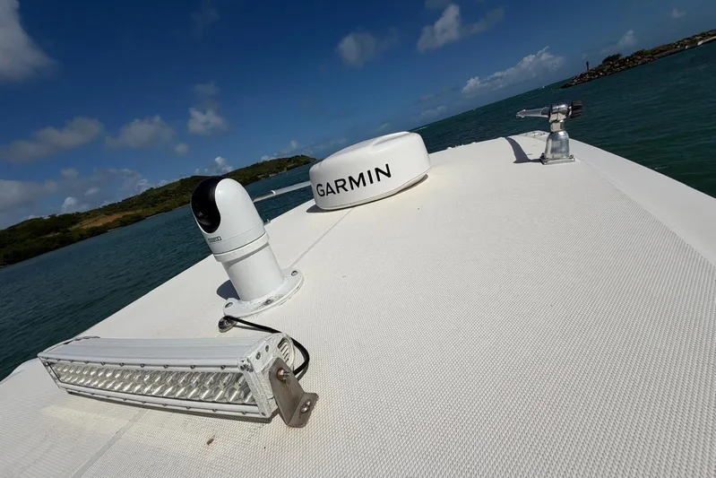  Yacht Photos Pics 2023 Fountain 34 Center Console boat with Garmin equipment on deck, ocean view.