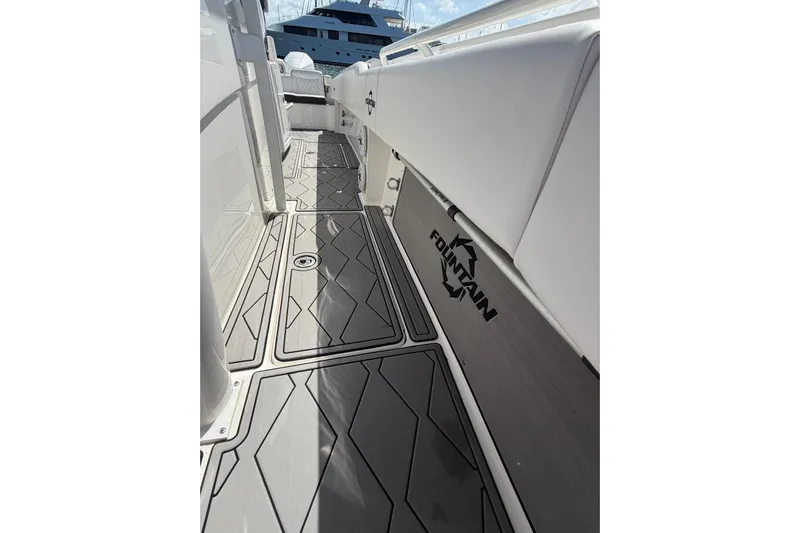  Yacht Photos Pics 2023 Fountain 34 Center Console boat interior with sleek flooring and logo.